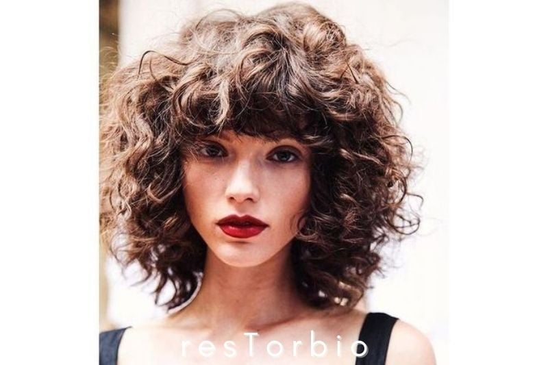 Voluminous Curly Hair with Bangs