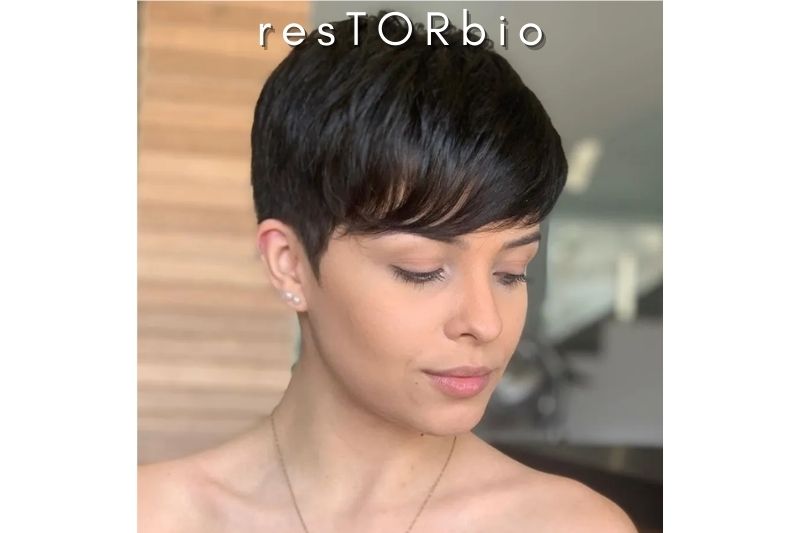 With Massive Bangs, a Short Feathered Pixie Cut