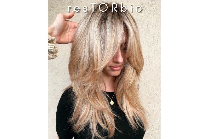Long, flowing, and feathered hairstyle